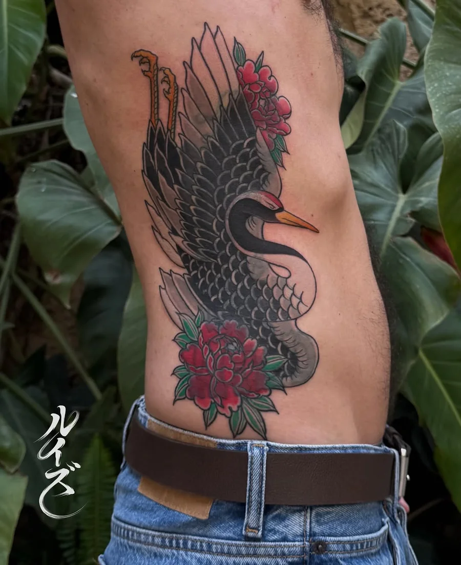 Black bird tattoo with red berries on the thigh by Luise (Lulu)