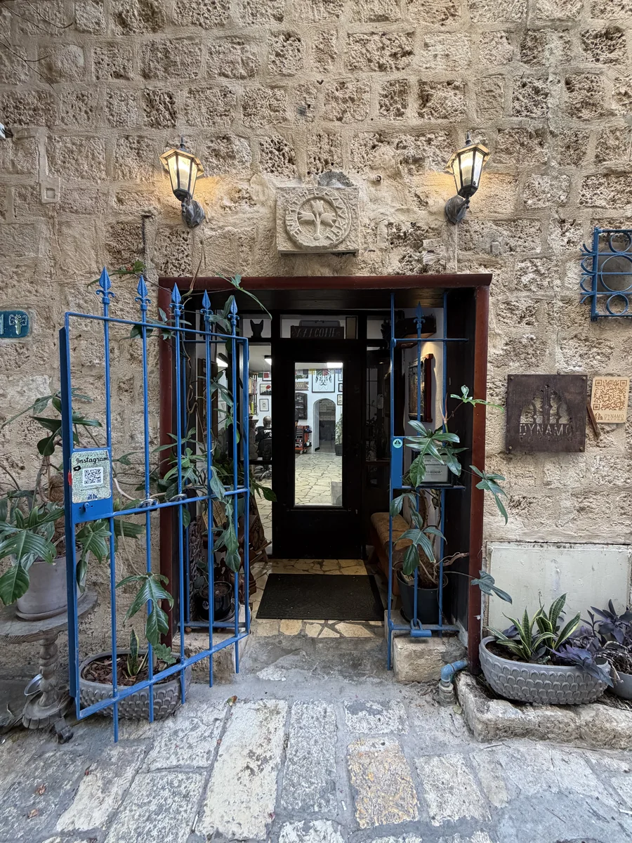 DYNAMO studio entrance in a limestone alley in Old Jaffa