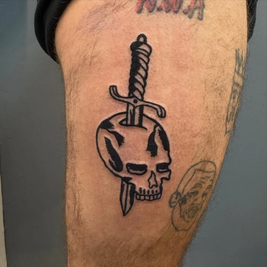 Black illustrative skull pierced by a downward-pointing dagger.